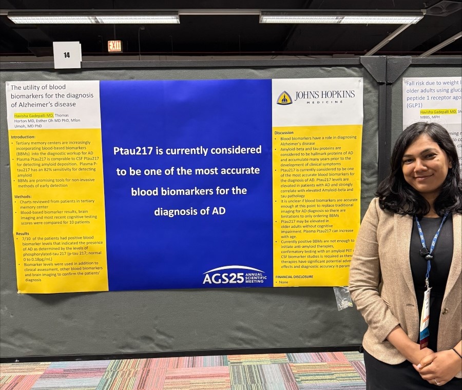 doctor with her poster at a conference