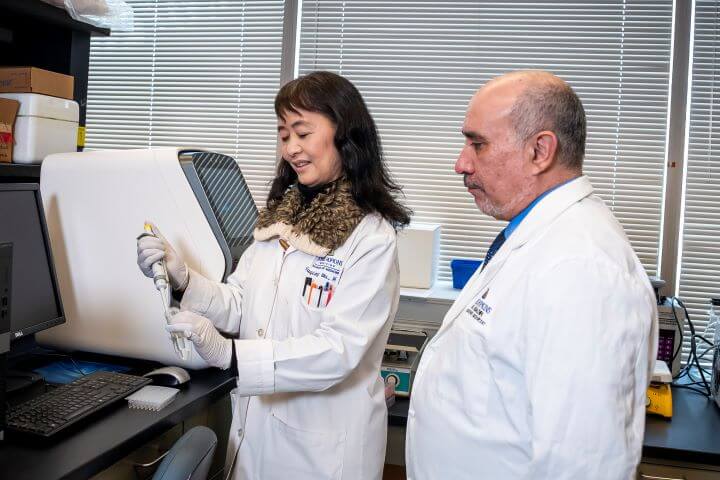 man and woman working in a lab