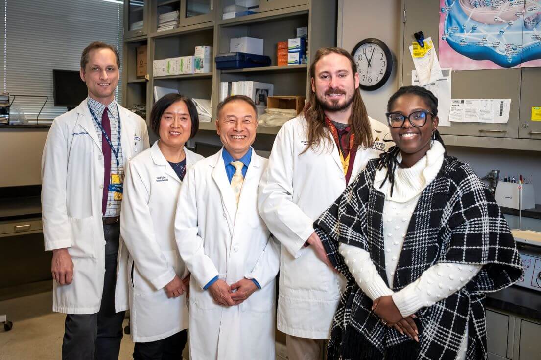 group of doctors and researchers in a lab
