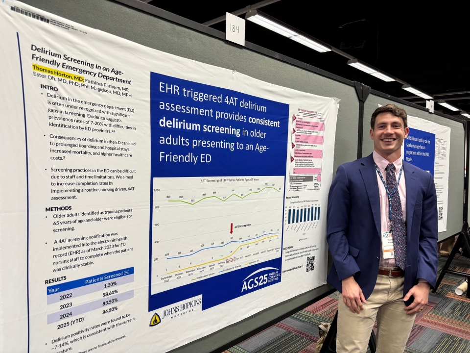 male doctor presents his research poster