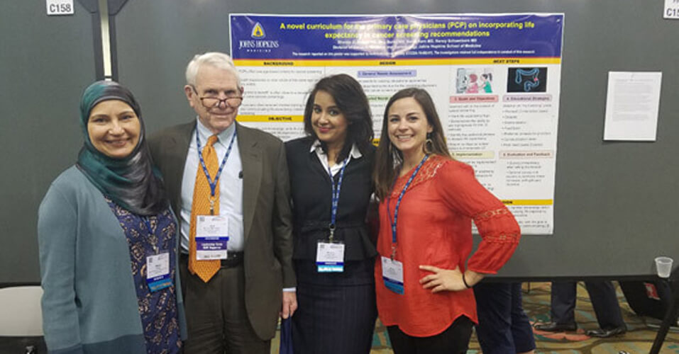 Fellows with doctor at the American Geriatric Society 
