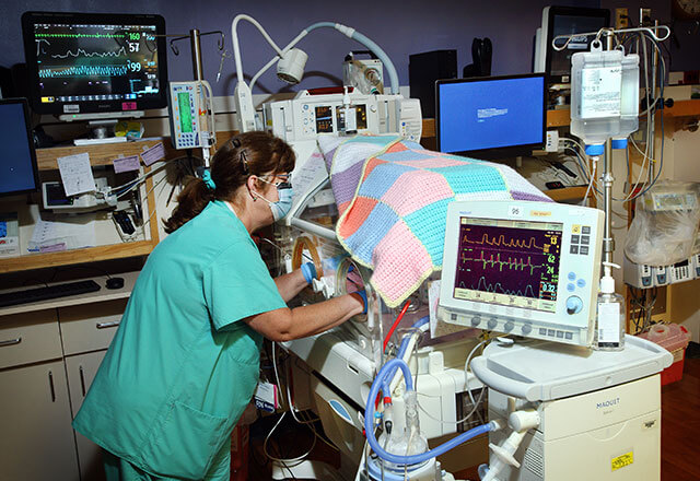 nurse cares for preemie