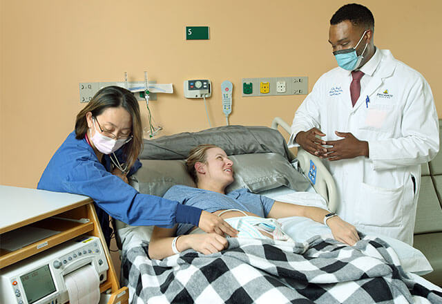 Dr. Vaught speaks to patient