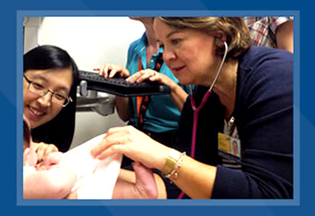 doctor and fellow work with patient