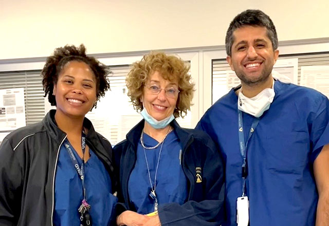 Three MFM Fellows in scrubs smiling