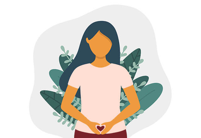 person holds hands in shape of heart over pelvis