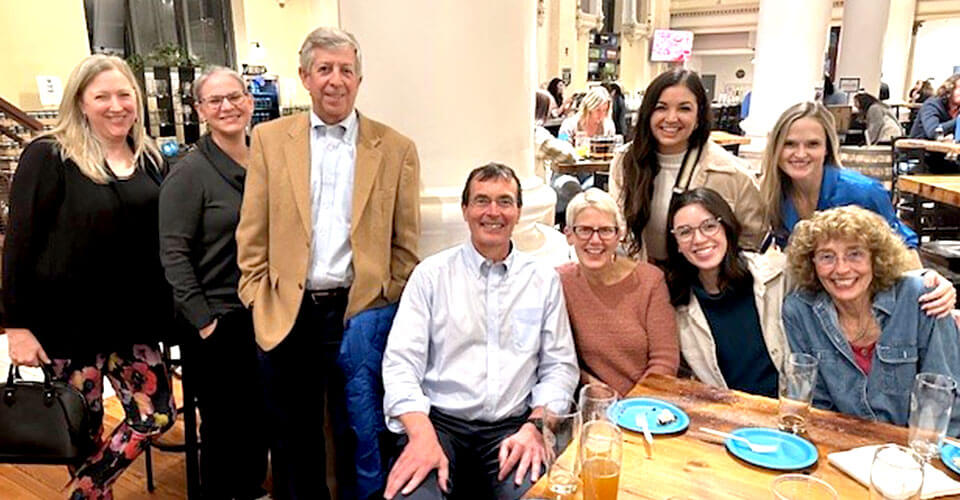 fellows with professors in dining hall