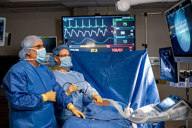 Ahmet Baschat and Mara Rosner performing procedure