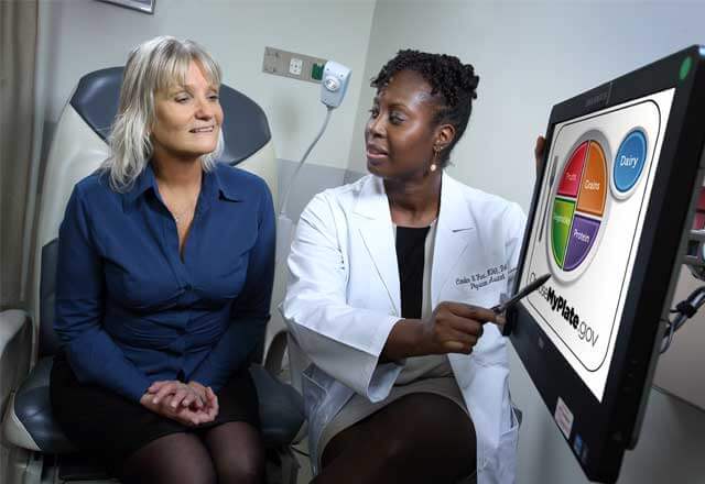 nurse shows patient image on screen