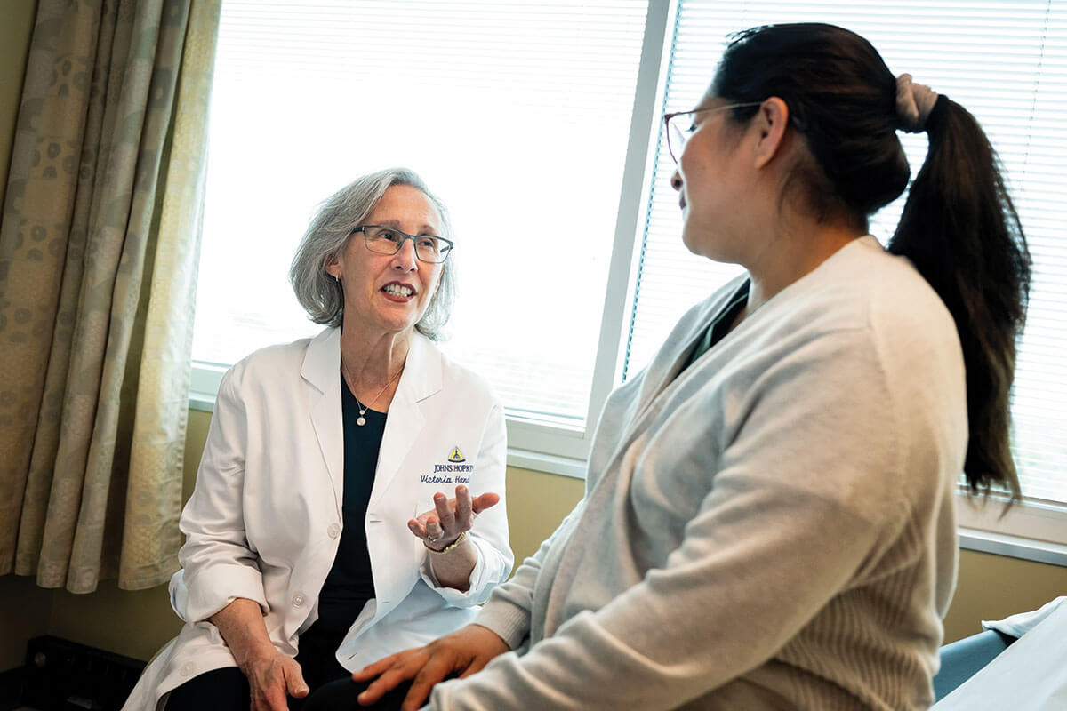 Dr. Victoria Handa talks with a patient