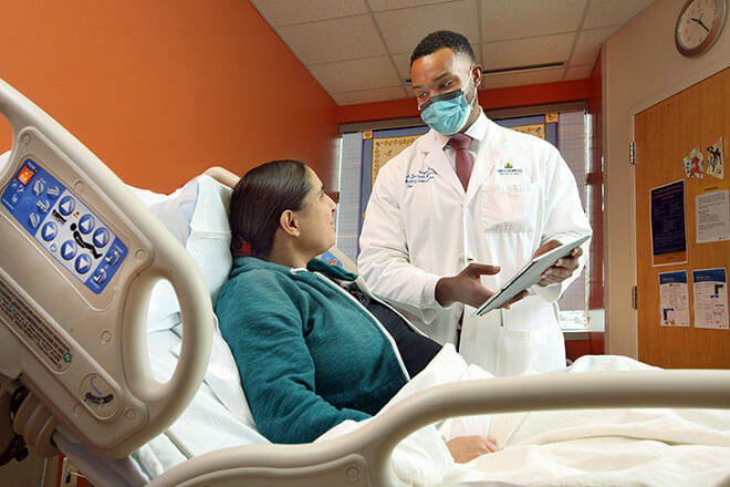 Dr. Jason Vaught consults with a patient