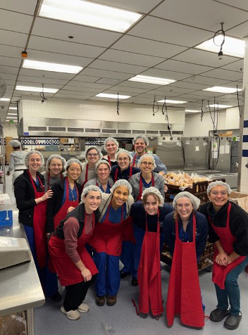 students volunteering at soup kitchen