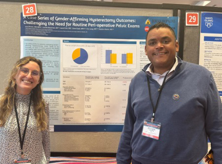 Student showing poster