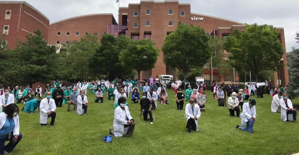 Faculty and staff at Bayview Medical Center taking a knee for racial equality