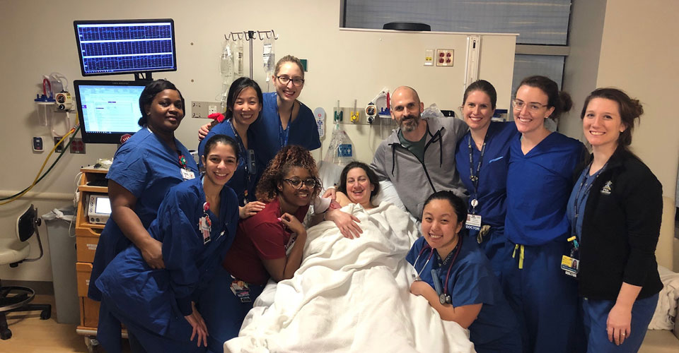 Gynecology residents gather after the birth of a resident's child