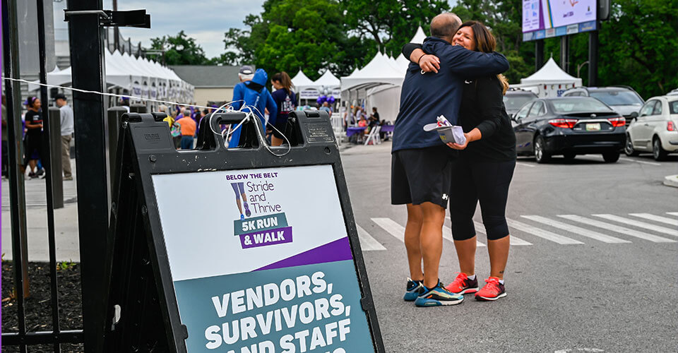doctor fader gives hug at event