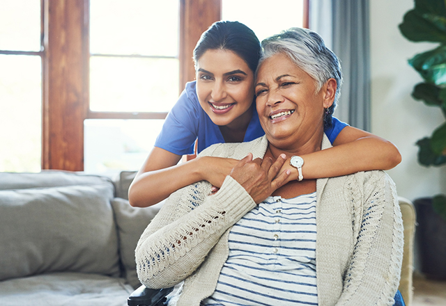ventricular assist devices - nurse hugging elderly lady