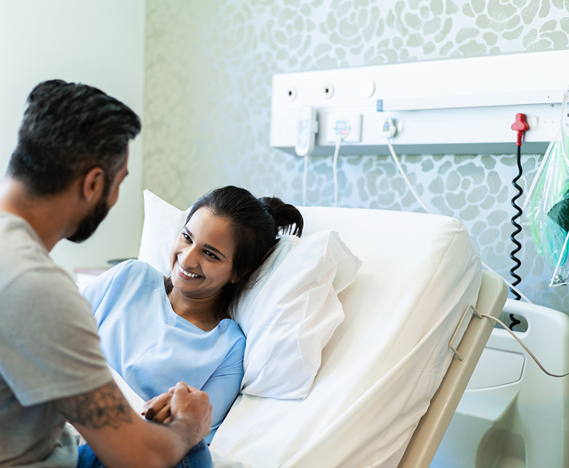 ventricular assist devices - woman in bed smiling at loved one