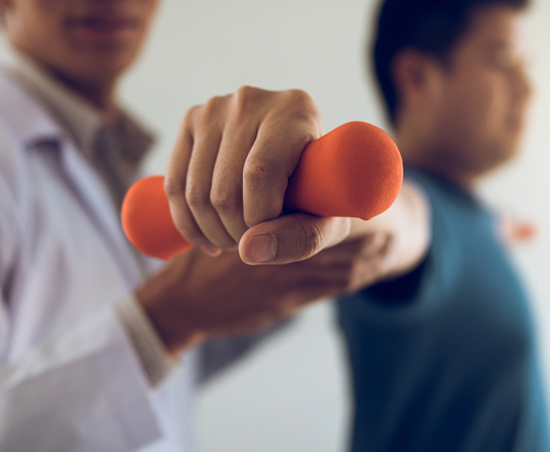 doctor helping patient exercise