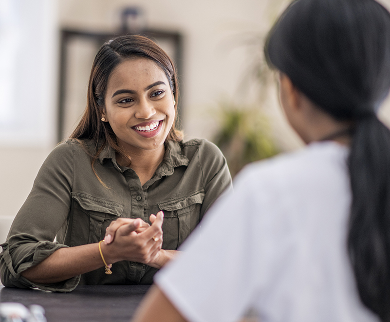 woman smiling at doctor