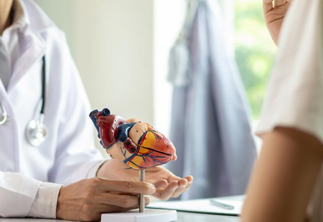 Doctor explaining heart condition to patient