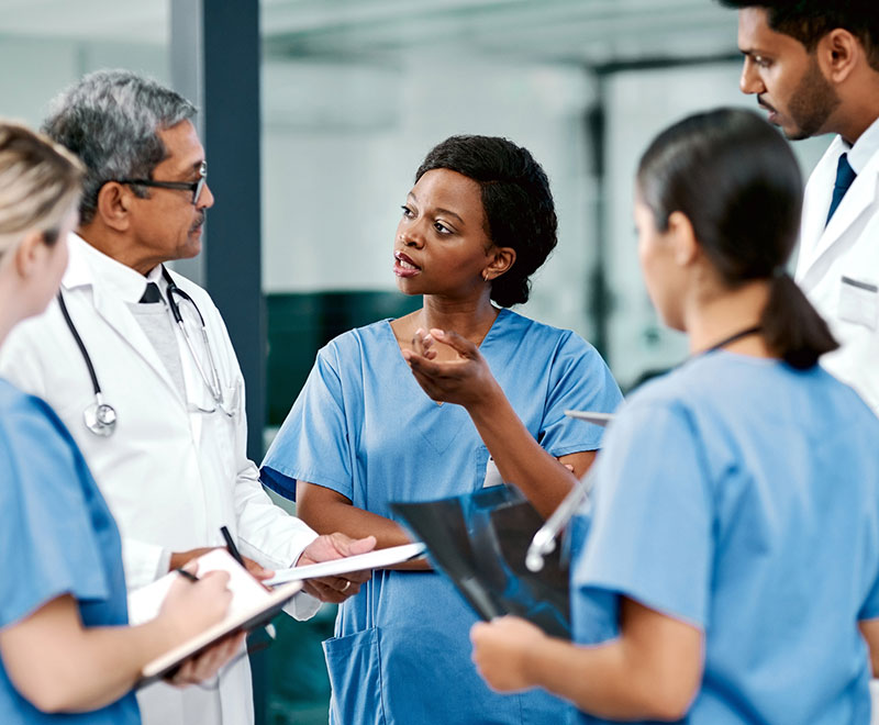 a group of medical professionals discussing a case