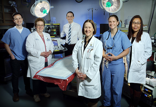 cardiac surgery research - group picture of Dr. Lawton's team near gurney