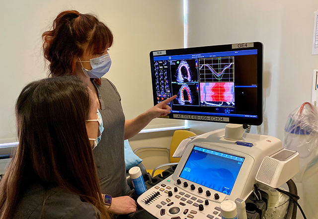 cardiac sonography training program - student performing cardiac ultrasound on patient in Johns Hopkins