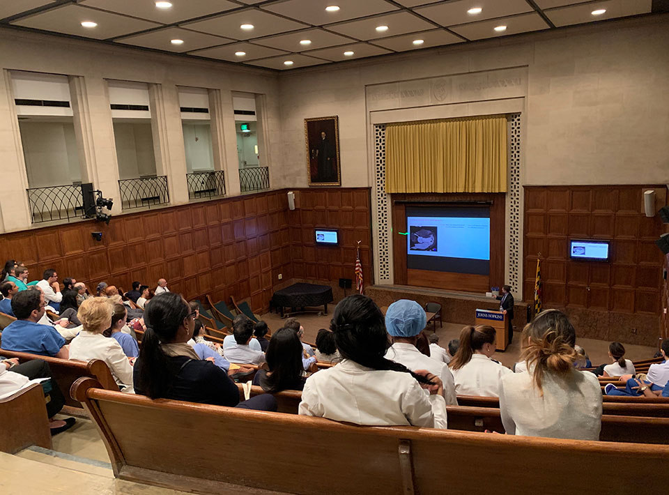 fellows watching a grand rounds presentation
