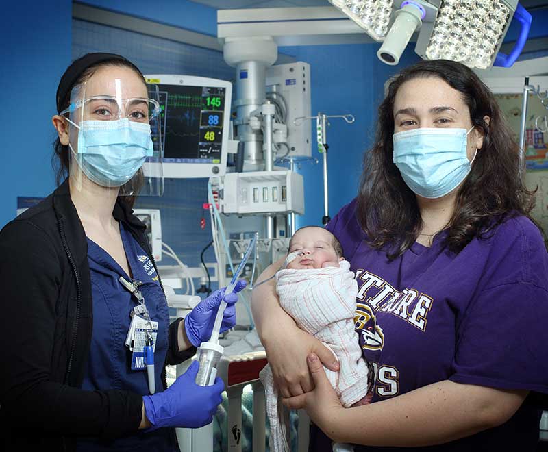 A nurse, mom and newborn baby