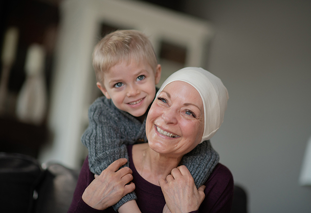 heart and vascular - woman wearing scarf smiling with grandson