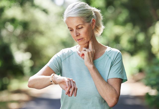 Woman checking her heart rate