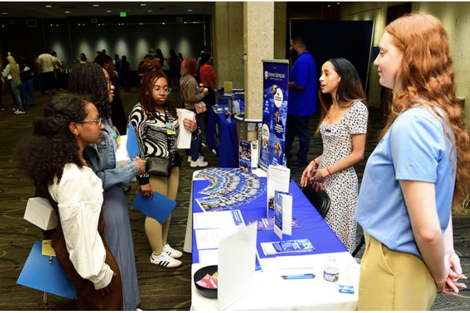 Attendees interacting at a table