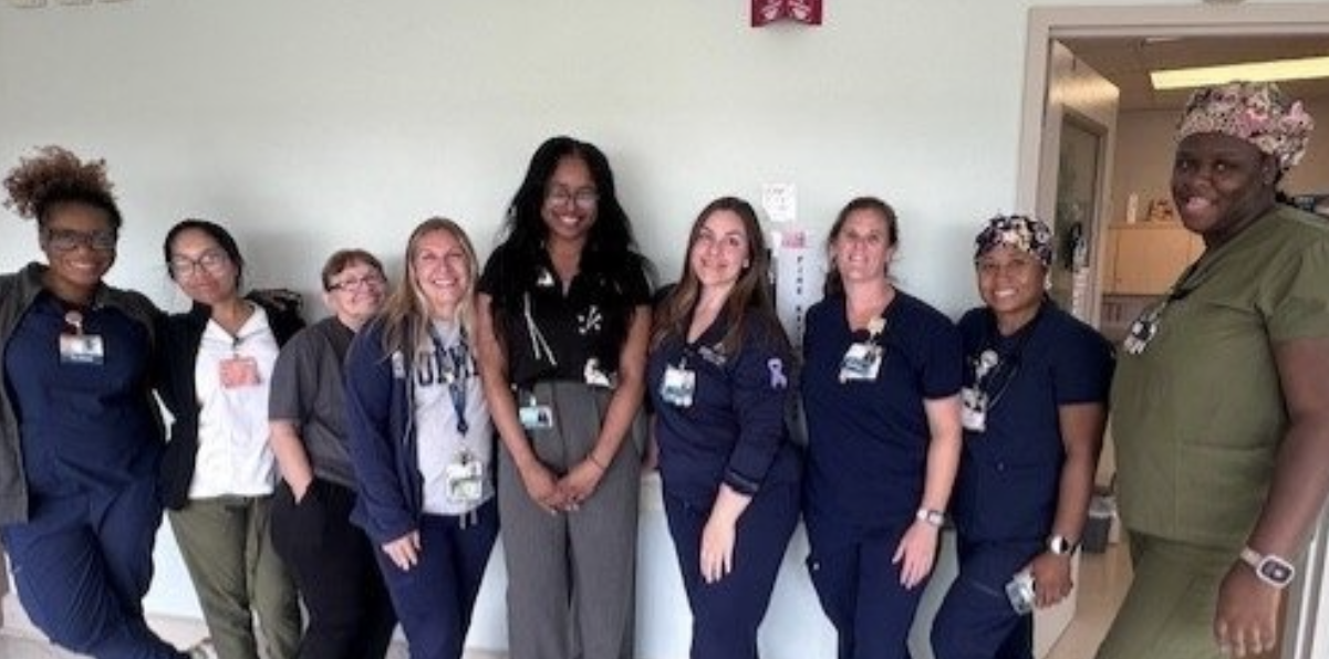 Group of women posing in a hallway