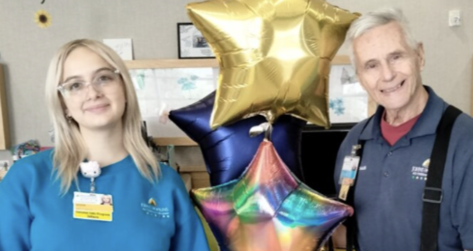 Sasha posing with balloons