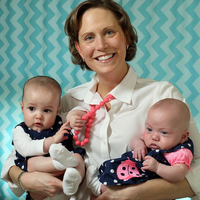 Elizabeth Edsall Kromm holds her two baby girls.