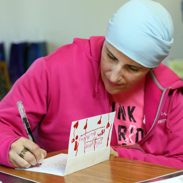 Woman writing in a handmade card
