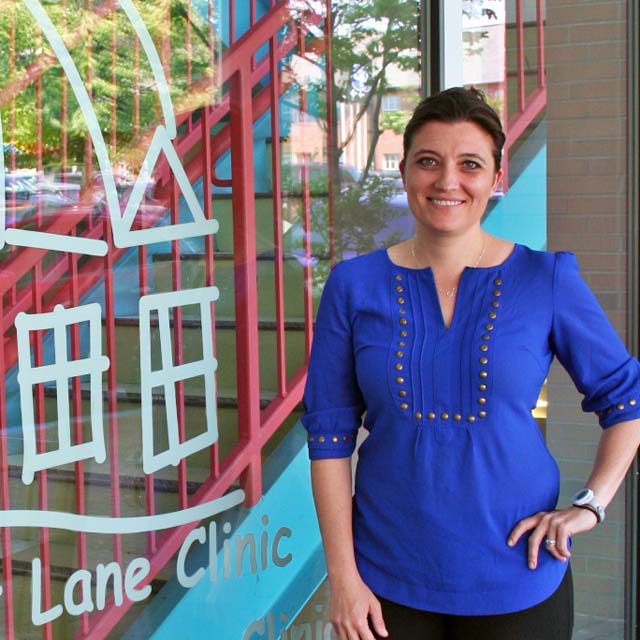 Photo of Megan Tschudy outside the Harriet Lane Clinic.
