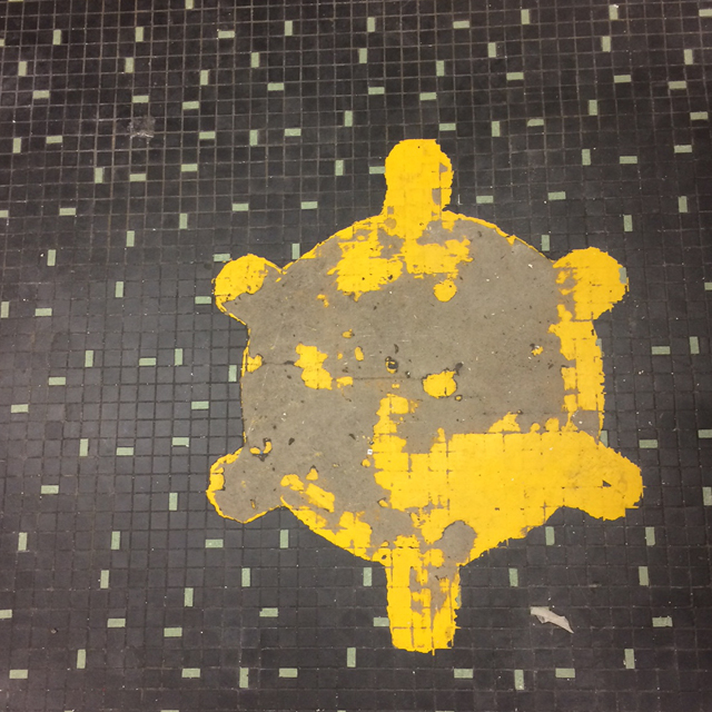 Photo of the floor compass created by neurosurgeon Walter Dandy to help align the patient's head for X-rays.