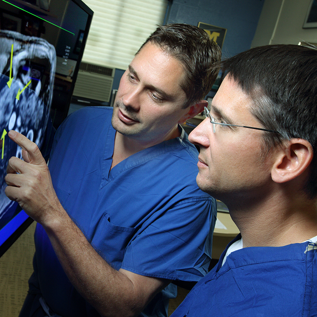 A photo shows Timothy Pawlik and Christopher Wolfgang.