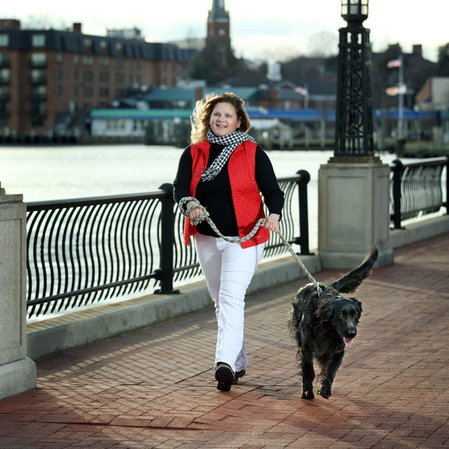 Mary Robertson walking her dog