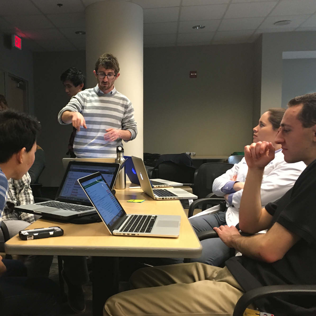 The image shows participants in the Entrepreneurial Accelerator Program.