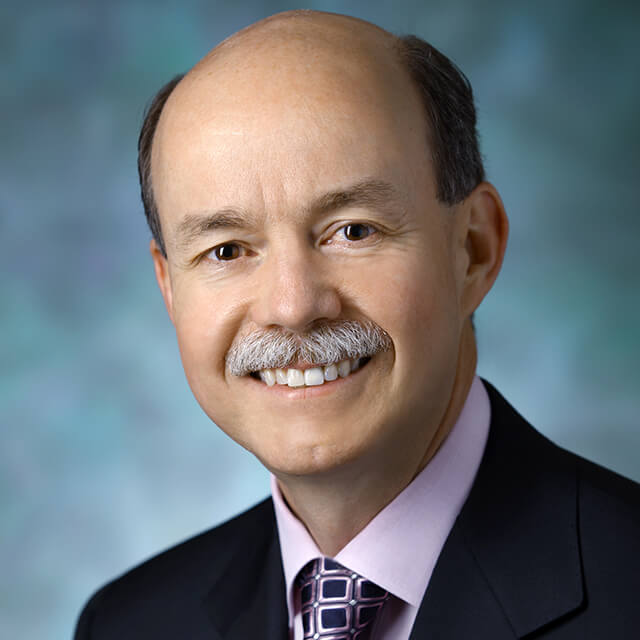 A photo shows Theodore DeWeese.