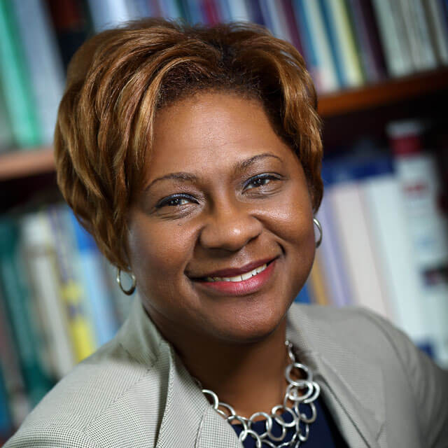 A photo shows Felicia Hill-Briggs.