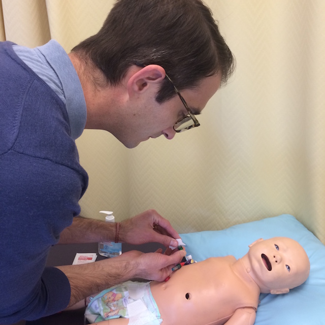 Simulating central line care on a mannequin