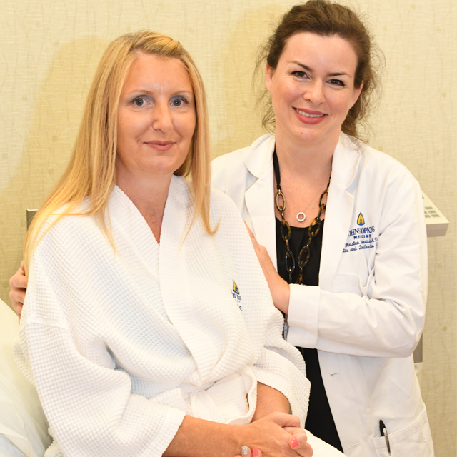 Dr. Broderick standing with patient Sue Burrs