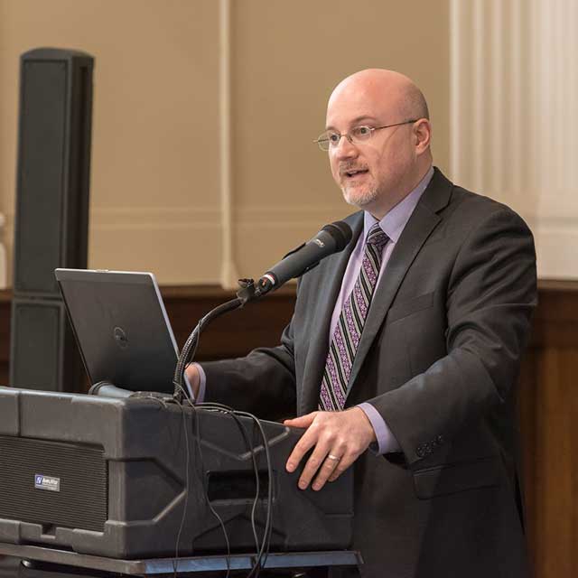image of David Newman-Toker talking at a podium