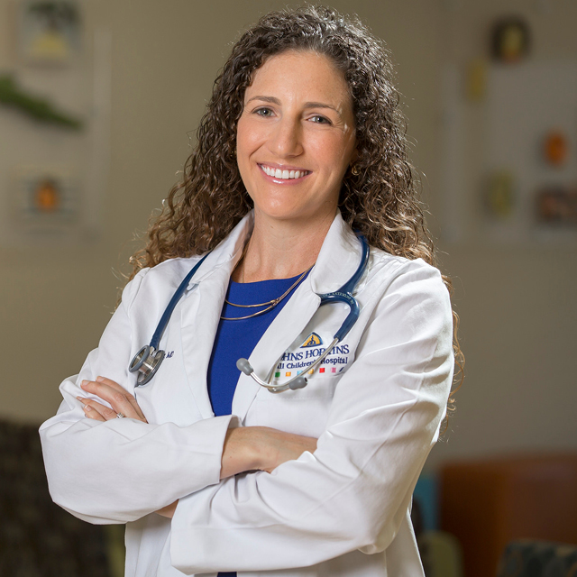 head shot of Jaquelyn Crews in scrubs.