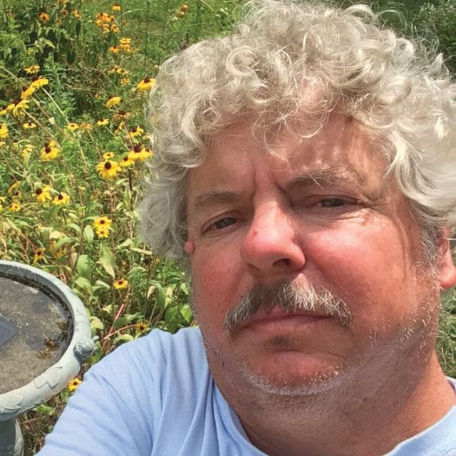 A photo shows Doug Hughes. 