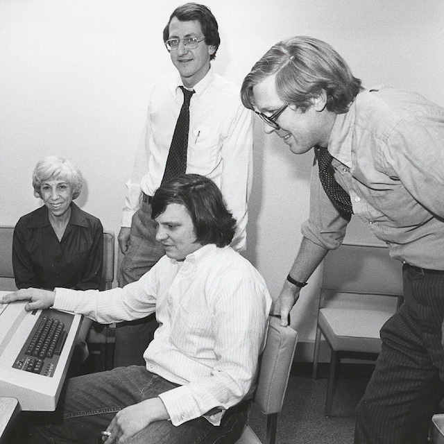 Ron Peterson and fellow administrators discuss the hospital’s cost improvement program in 1976.
